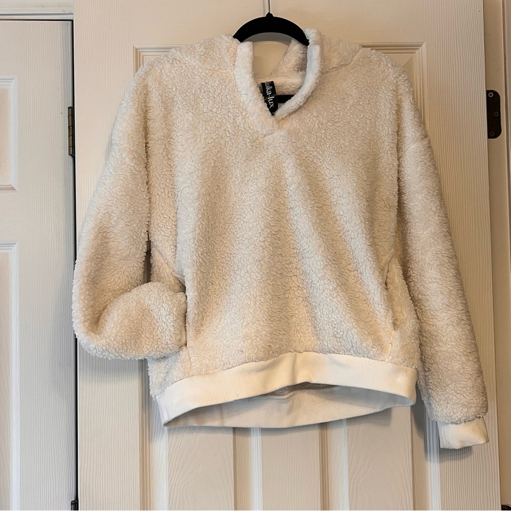 White fleece pullover with pockets and hood